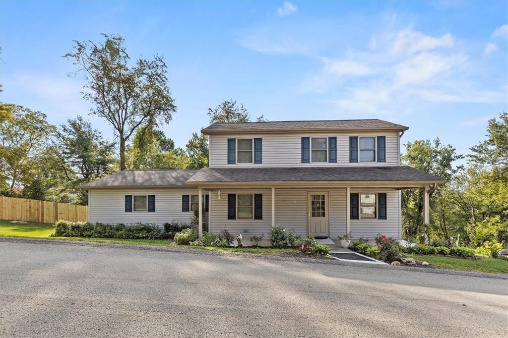 front view of a house with a street