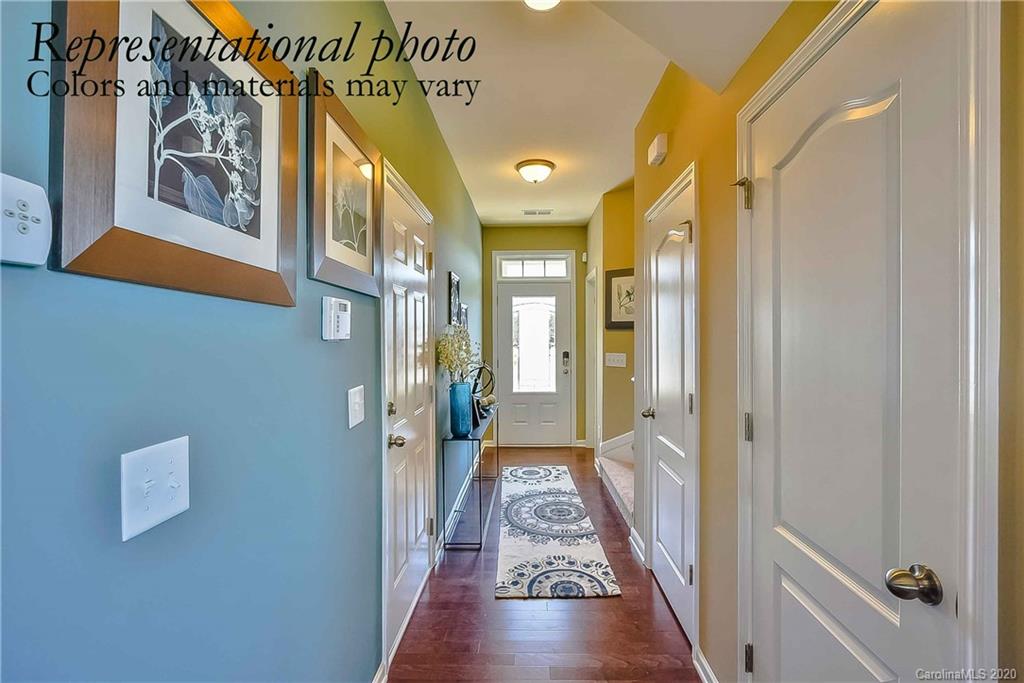 1633 Corwin Bend Road Tega Cay, SC 29708 - Photo 2 of 10 a view of a hallway with wooden floor