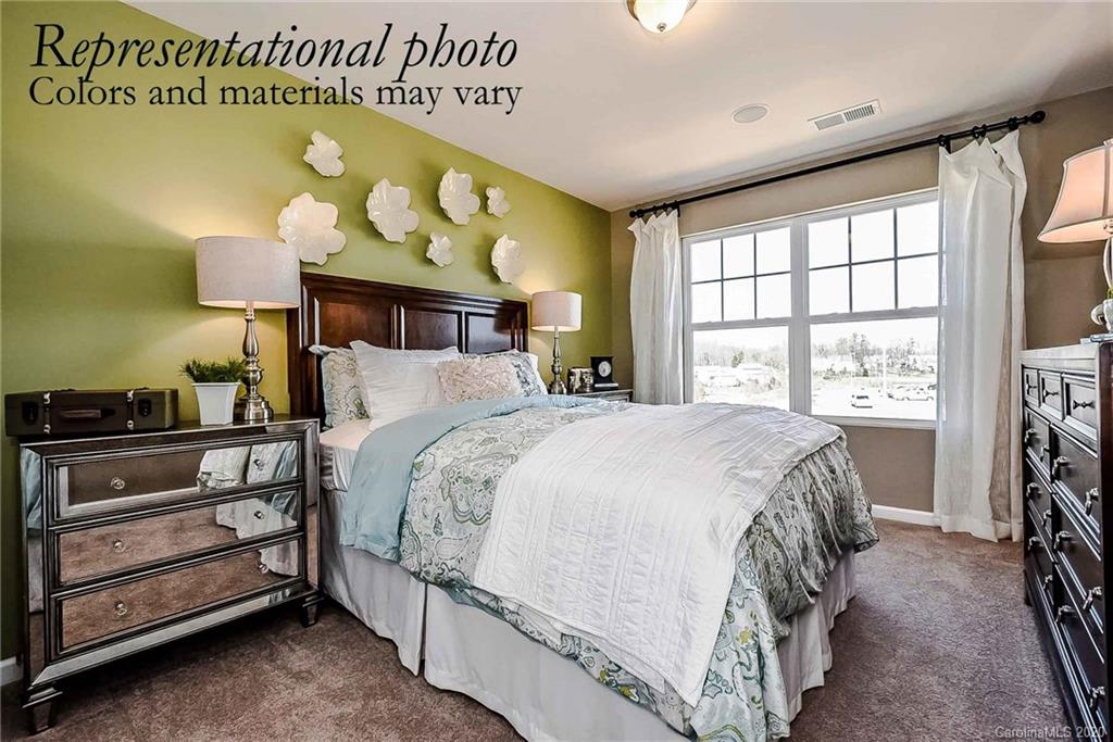 1633 Corwin Bend Road Tega Cay, SC 29708 - Photo 10 of 10 a bedroom with a bed and a window