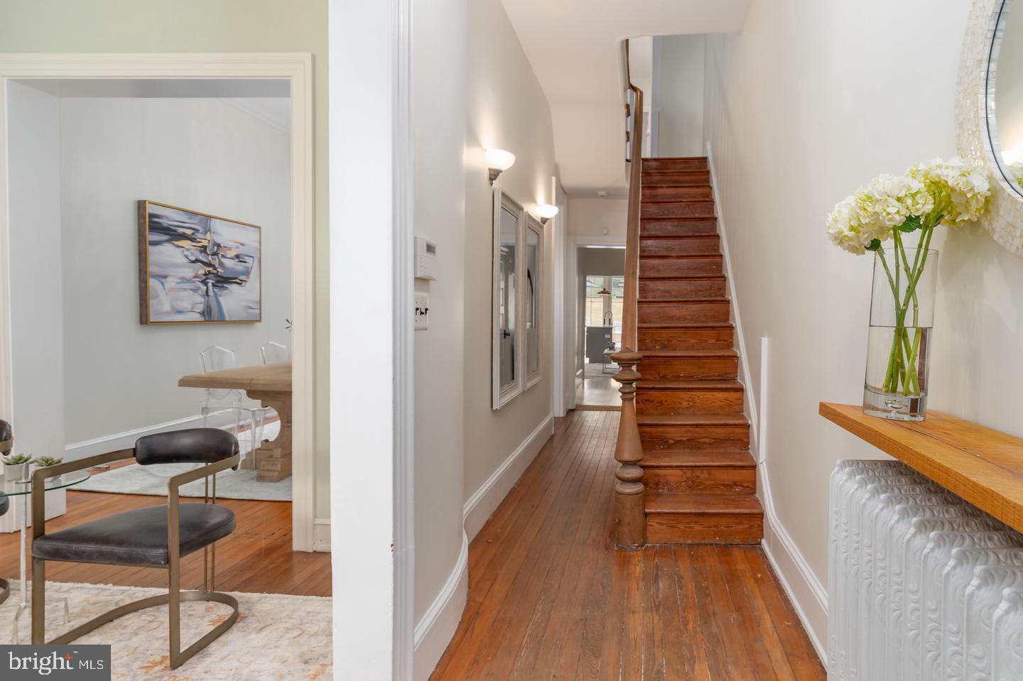 511 Independence Avenue Southeast Washington, DC 20003 - Photo 2 of 15 a view of a hallway with wooden floor and stairs
