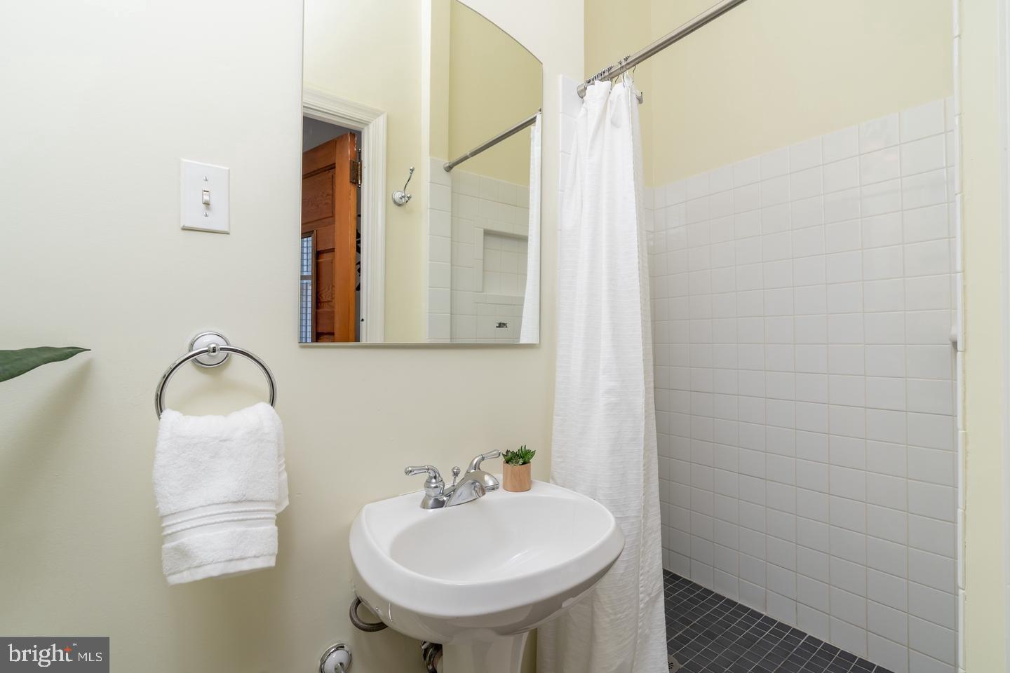 511 Independence Avenue Southeast Washington, DC 20003 - Photo 8 of 15 a bathroom with a sink and a mirror
