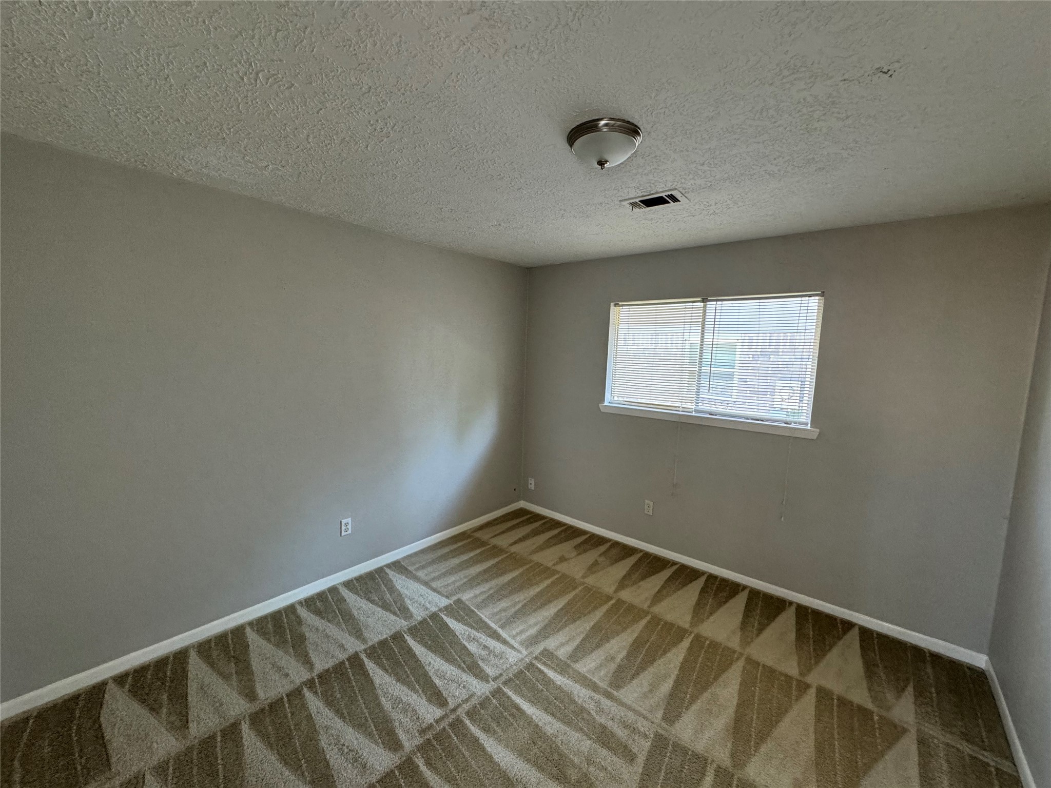 23227 Low Ridge Road Spring, TX 77373 - Photo 11 of 22 a view of a room with wooden floor and fan