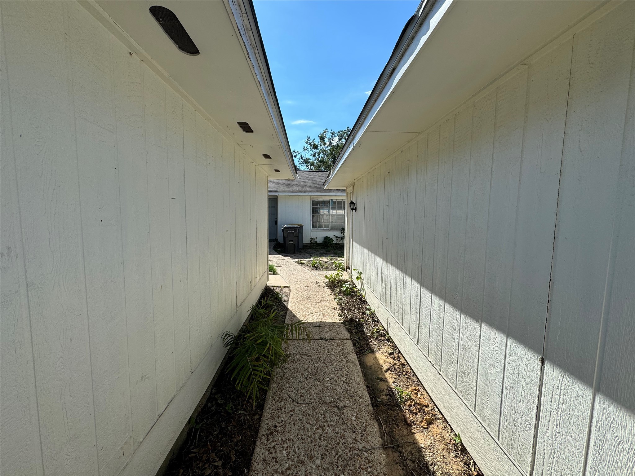 23227 Low Ridge Road Spring, TX 77373 - Photo 18 of 22 a view of a hallway with wooden floor and staircase