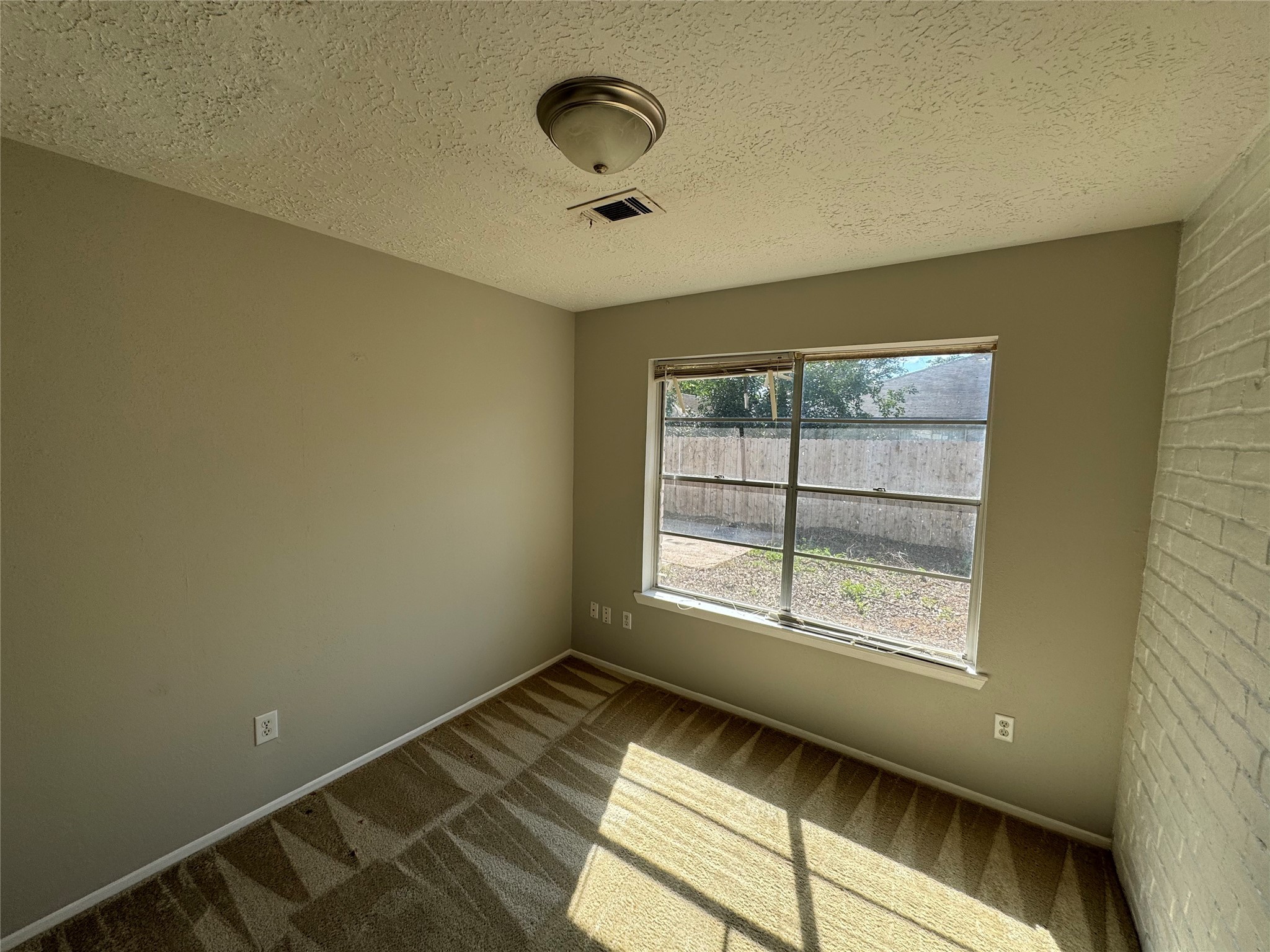 23227 Low Ridge Road Spring, TX 77373 - Photo 6 of 22 a view of an empty room with a window
