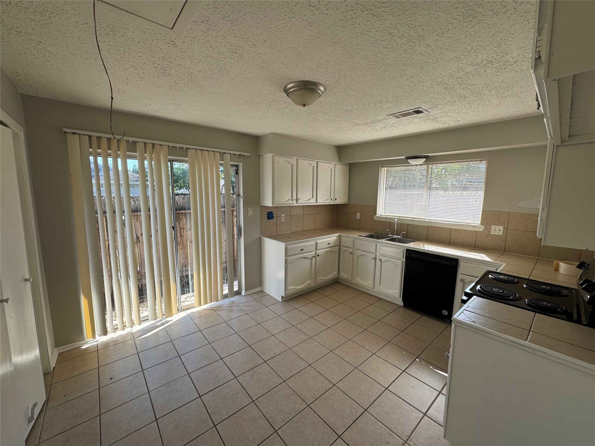 23227 Low Ridge Road Spring, TX 77373 - Photo 8 of 22 a kitchen with a cabinets and appliances