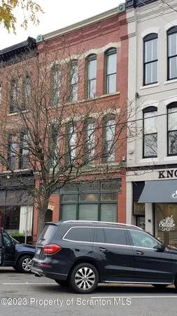 a room with a window and a lamp