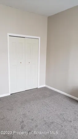 a view of hallway with closet