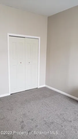 a view of hallway with closet