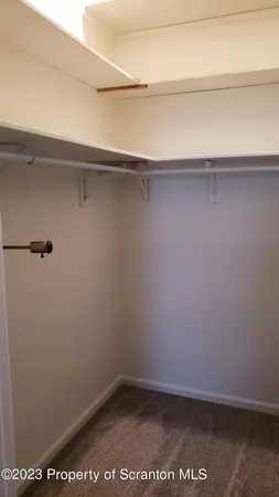 a bath tub sitting next to a white sink