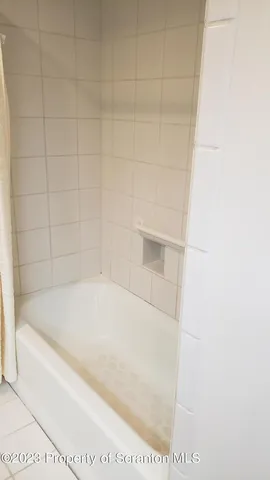 a stove top oven sitting inside of a kitchen