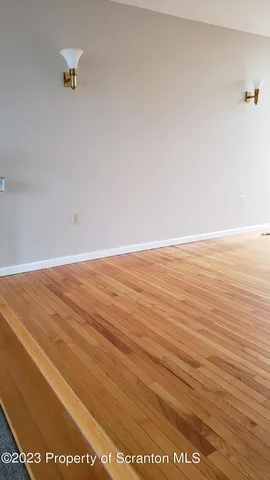 a view of cabinets and wooden floor