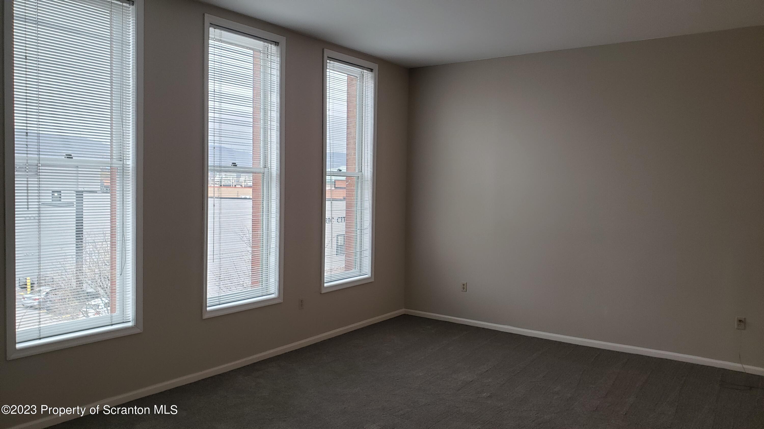 318 Penn Avenue Scranton, PA 18503 - Photo 48 of 70 an empty room with windows