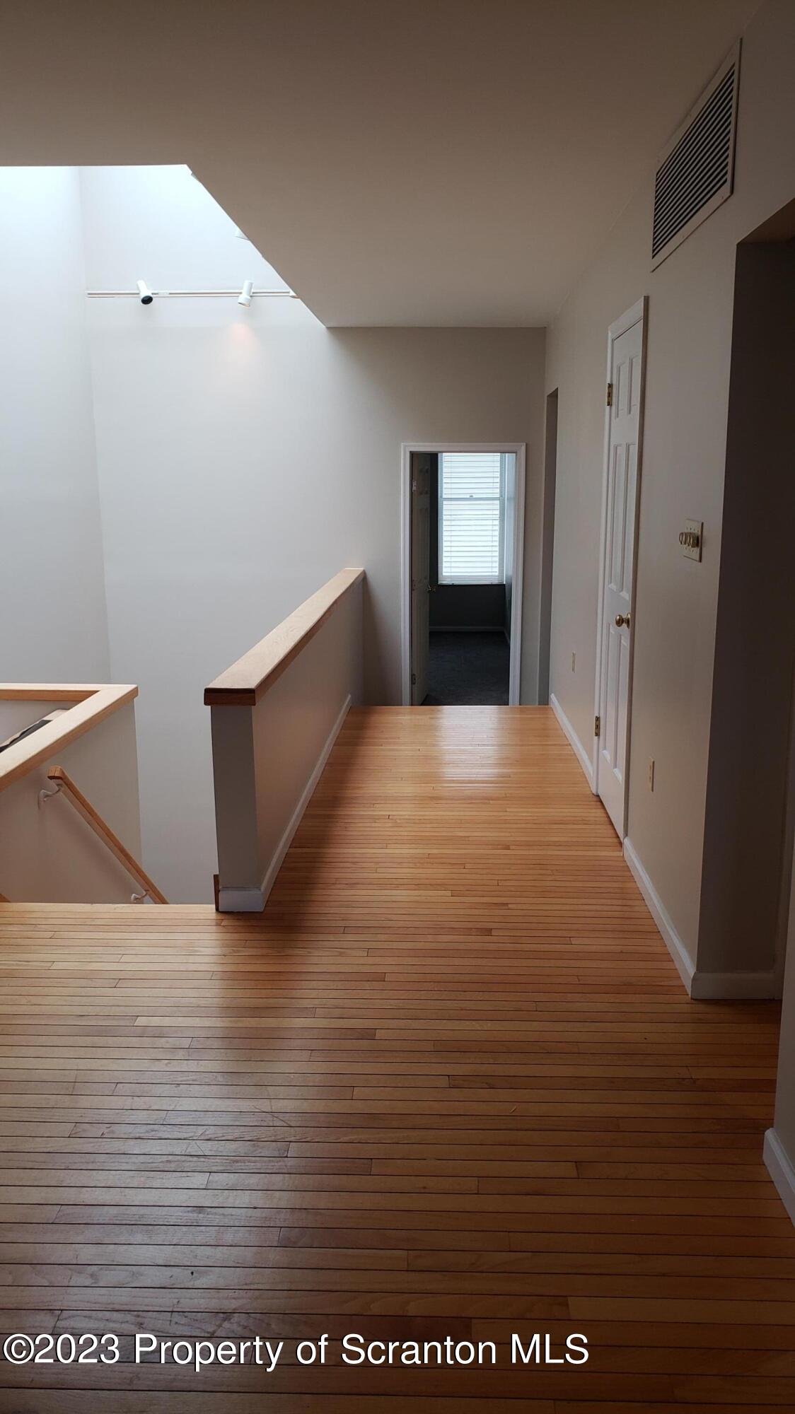 318 Penn Avenue Scranton, PA 18503 - Photo 54 of 70 a view of empty room with wooden floor
