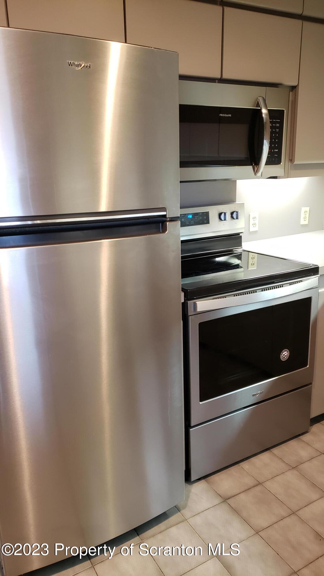 318 Penn Avenue Scranton, PA 18503 - Photo 56 of 70 a stove top oven sitting inside of a kitchen