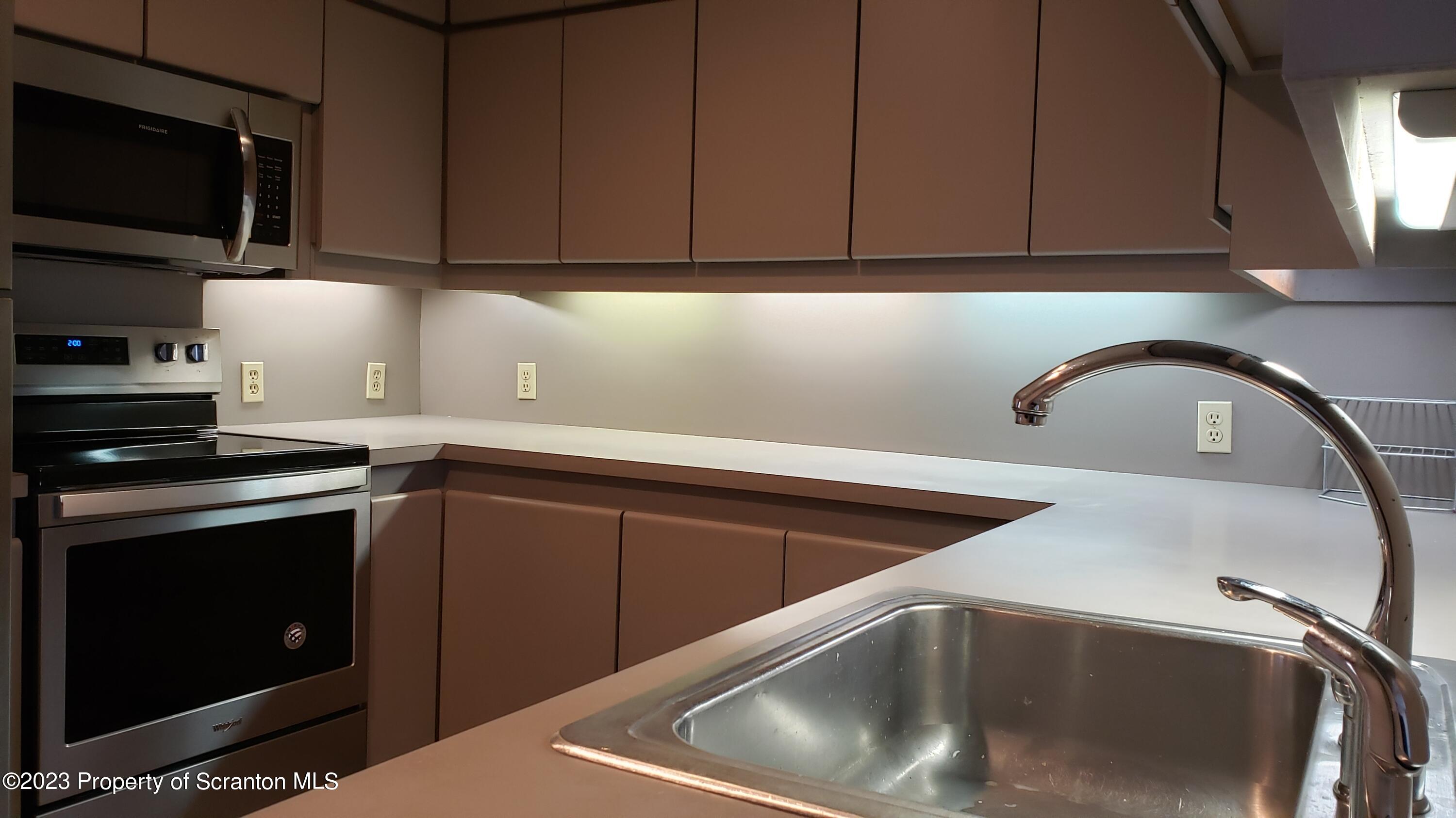 318 Penn Avenue Scranton, PA 18503 - Photo 63 of 70 a kitchen with a sink cabinets and stainless steel appliances