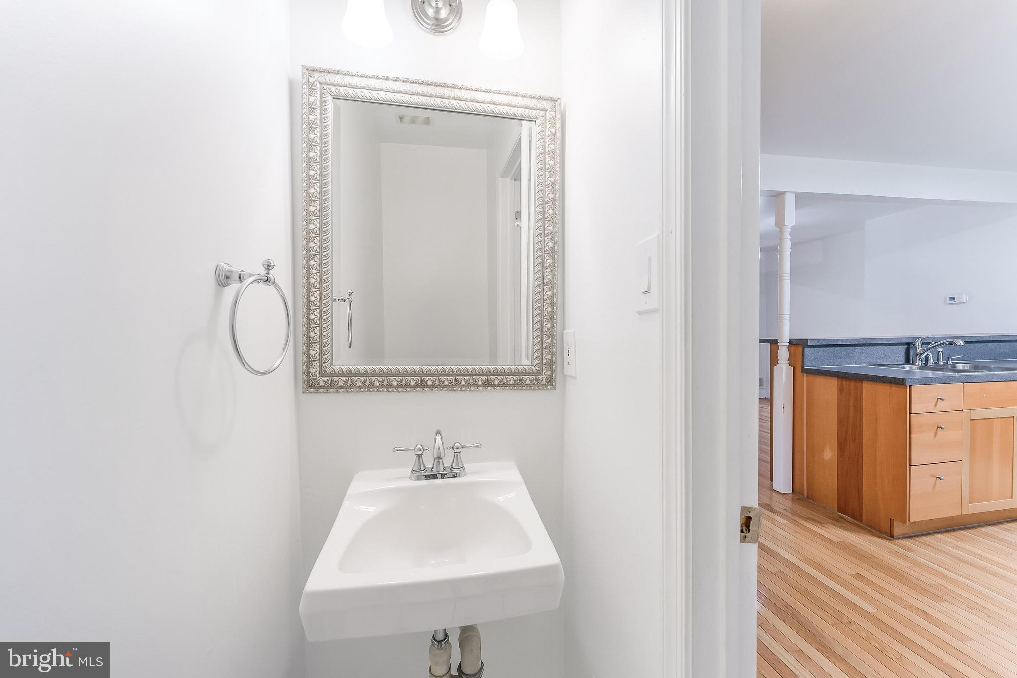 2331 Harleyford Court Reston, VA 20191 - Photo 9 of 40 Sleek half-bath with modern elegance.