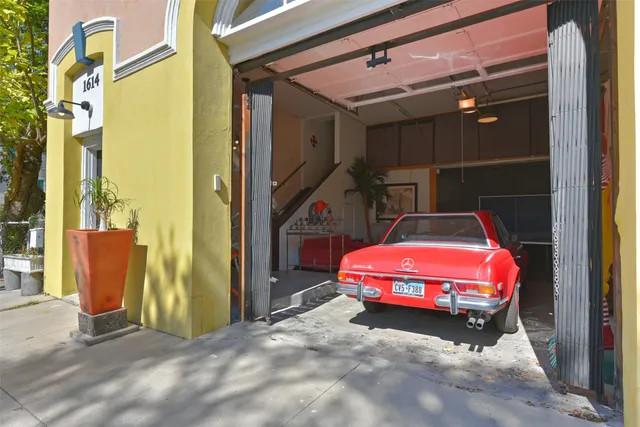 a bedroom with a bed and a mirror