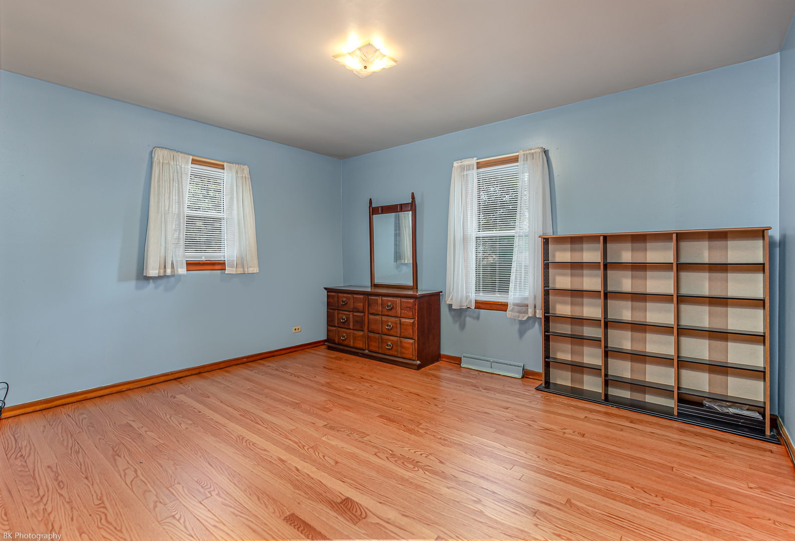 6041 Washington Street Chicago Ridge, IL 60415 - Photo 8 of 15 an empty room with wooden floor closet and windows