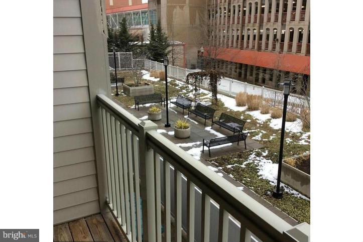 8045 Newell Street, Unit 220 Silver Spring, MD 20910 - Photo 12 of 21 Private Balcony Overlooking Courtyard