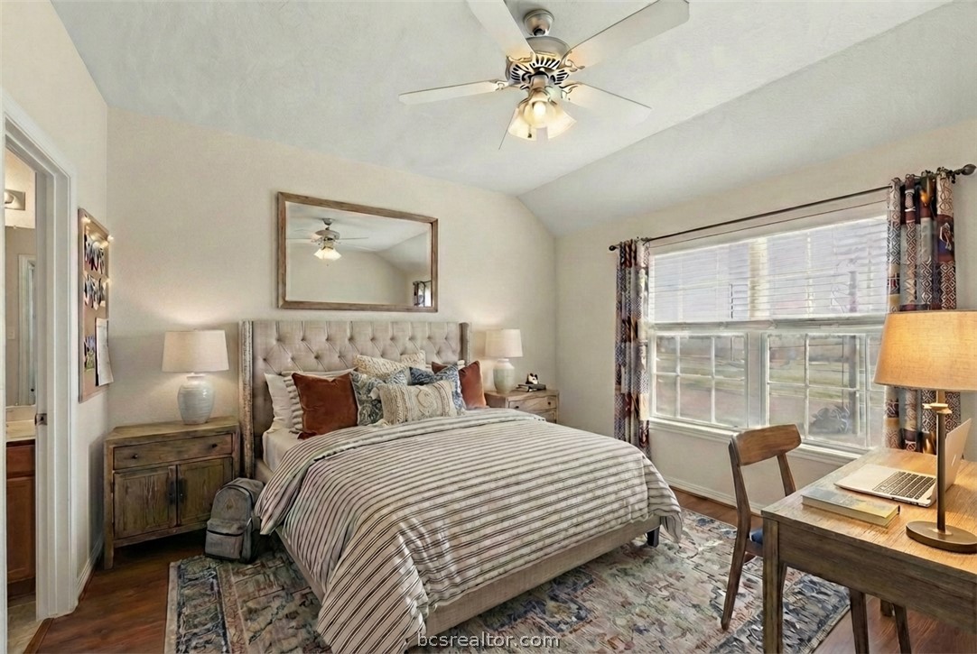 1198 Jones-Butler Road, Unit 3005 College Station, TX 77840 - Photo 13 of 24 a bedroom with a bed a chandelier and a window