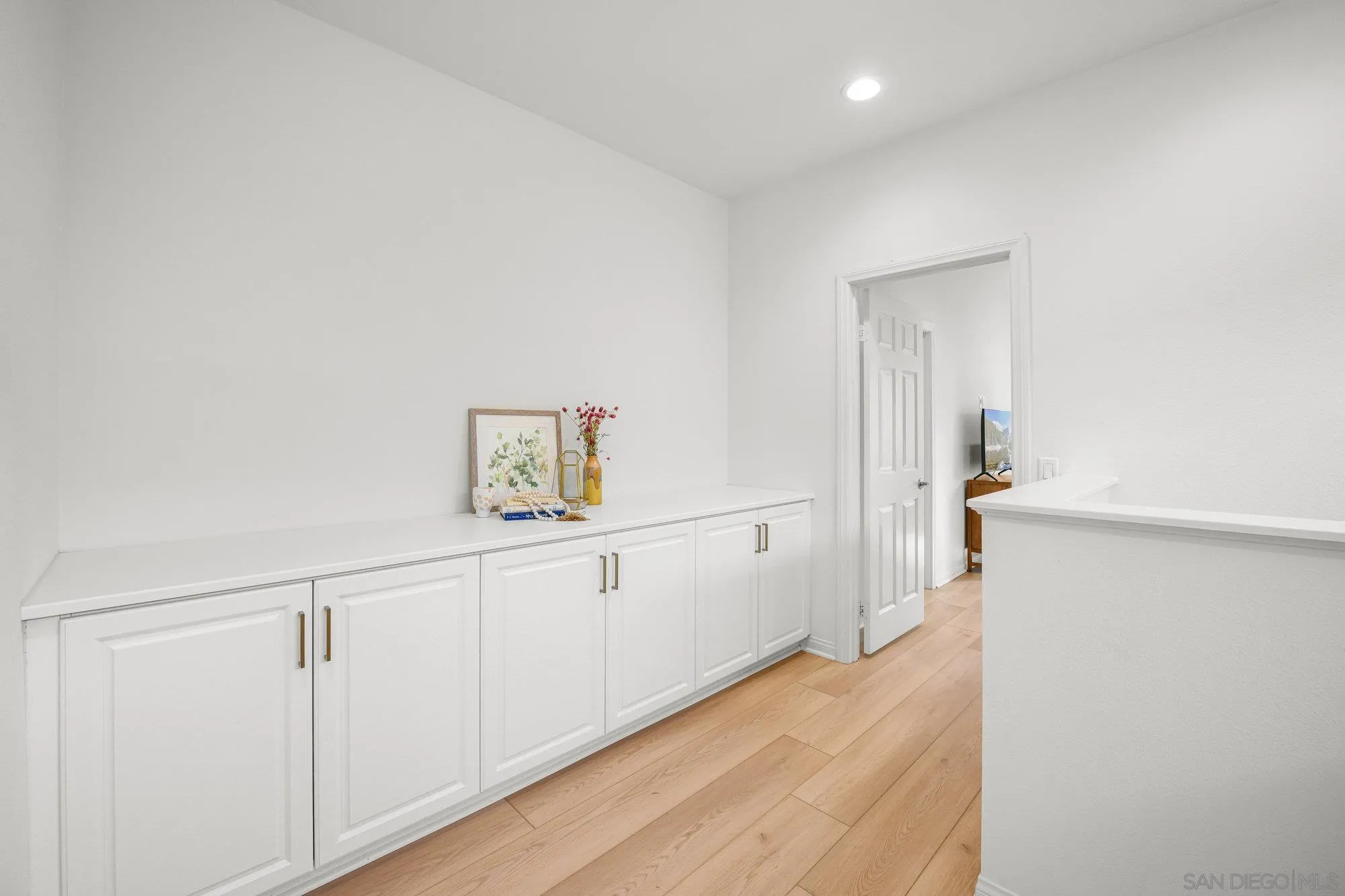 2612 Babaco Street Spring Valley, CA 91977 - Photo 16 of 37 a view of a hallway with wooden floor