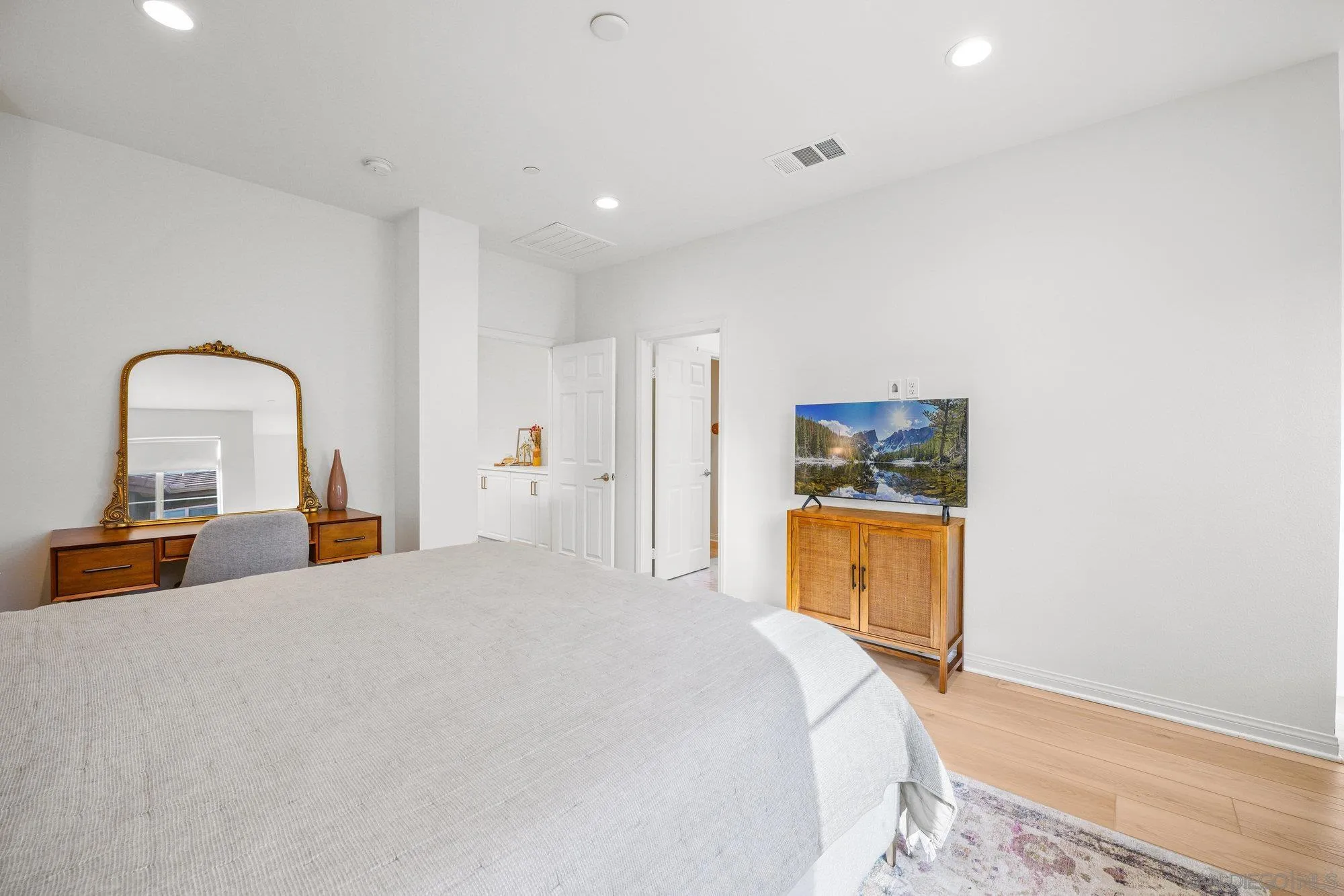 2612 Babaco Street Spring Valley, CA 91977 - Photo 17 of 37 a bedroom with a bed and a dresser