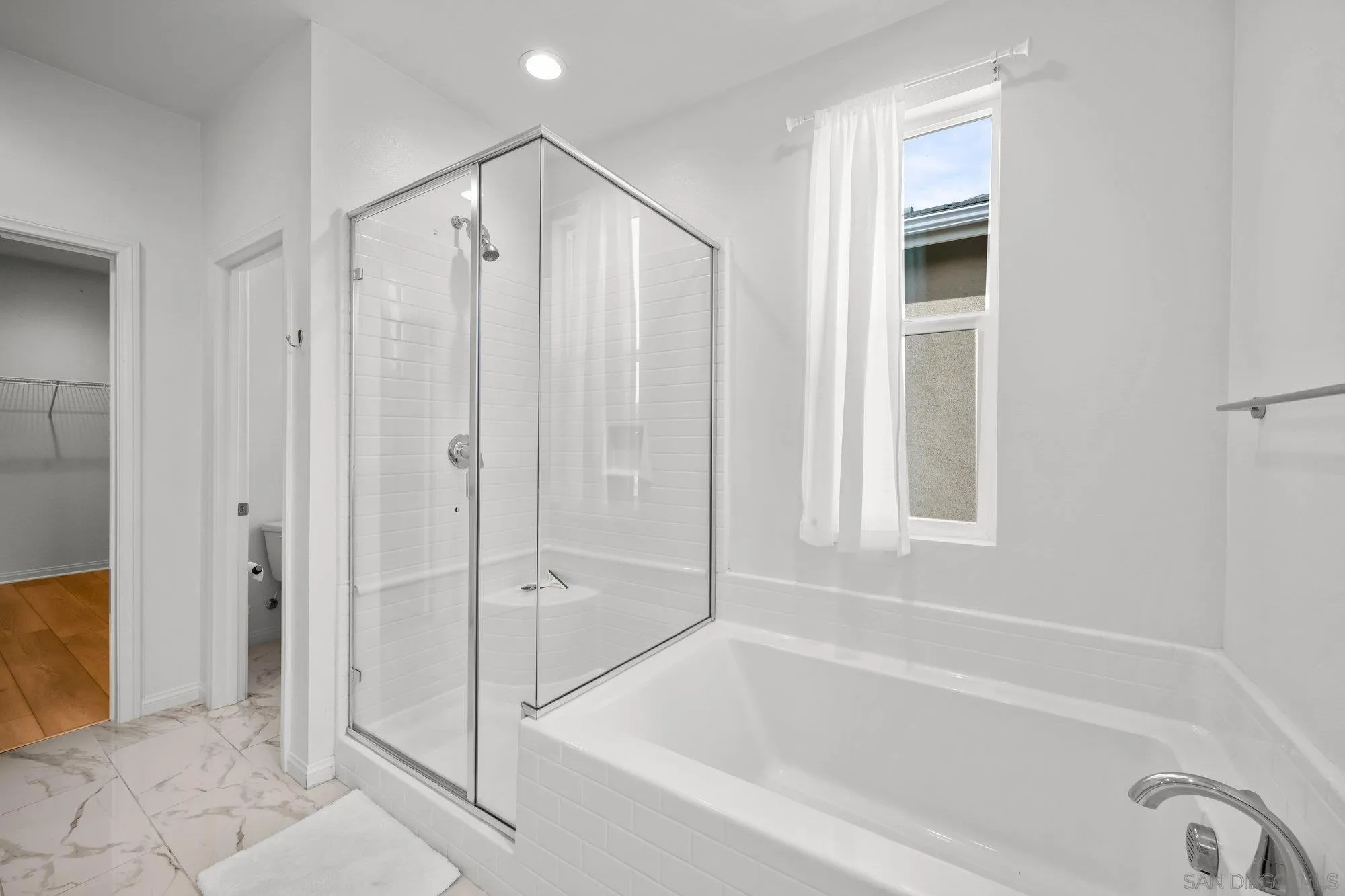 2612 Babaco Street Spring Valley, CA 91977 - Photo 20 of 37 a bathroom with a bathtub and a shower
