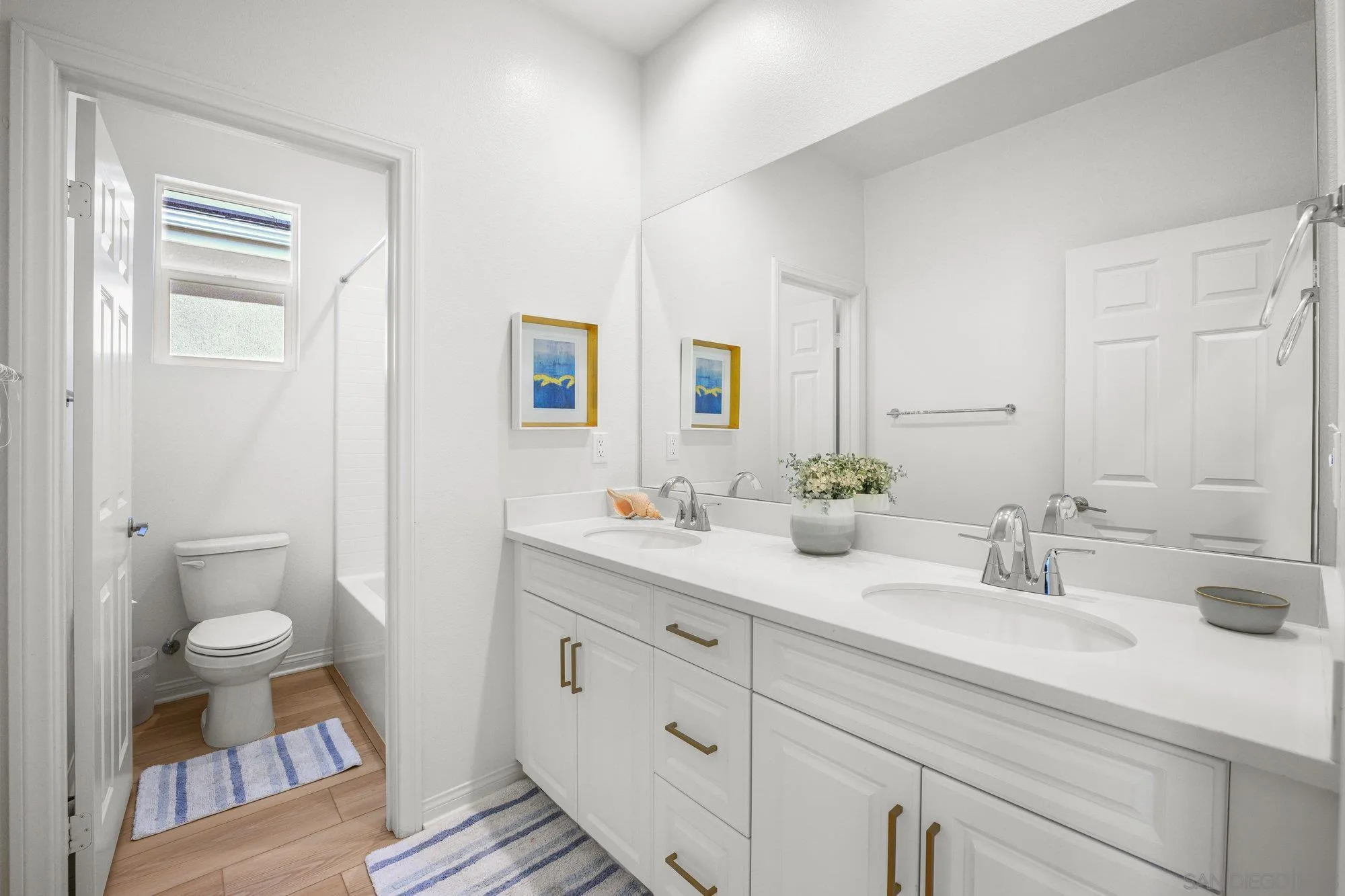 2612 Babaco Street Spring Valley, CA 91977 - Photo 22 of 37 a bathroom with a sink and a mirror