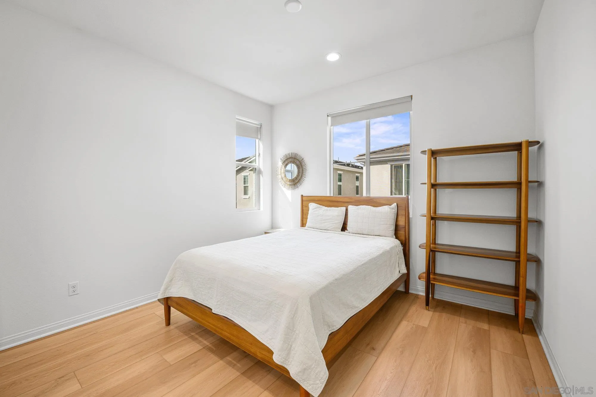 2612 Babaco Street Spring Valley, CA 91977 - Photo 23 of 37 a bedroom with a bed and a window