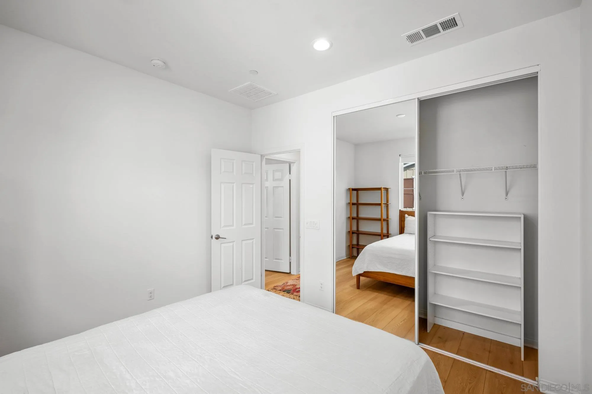 2612 Babaco Street Spring Valley, CA 91977 - Photo 24 of 37 a bedroom with a bed and furniture