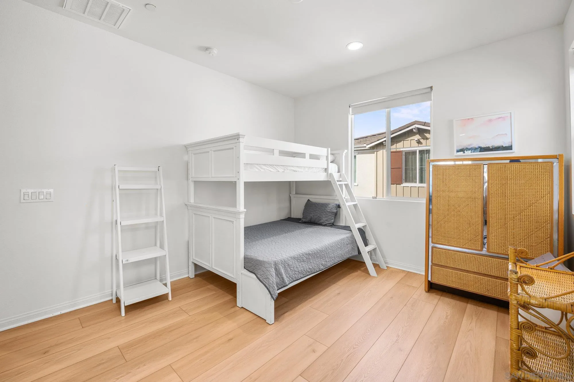 2612 Babaco Street Spring Valley, CA 91977 - Photo 25 of 37 a living room with a bed furniture and a window