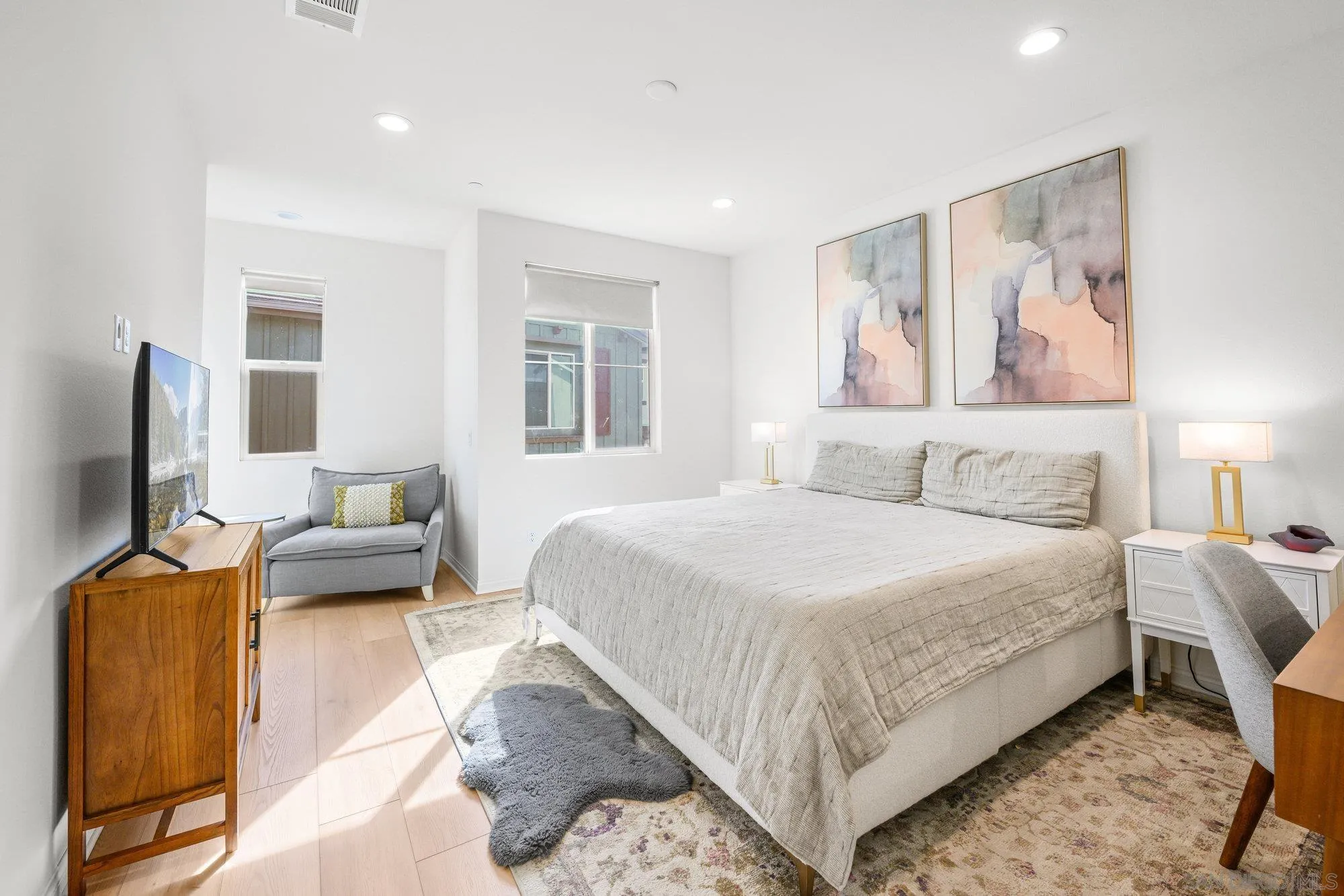 2612 Babaco Street Spring Valley, CA 91977 - Photo 4 of 37 a bedroom with a bed and couch