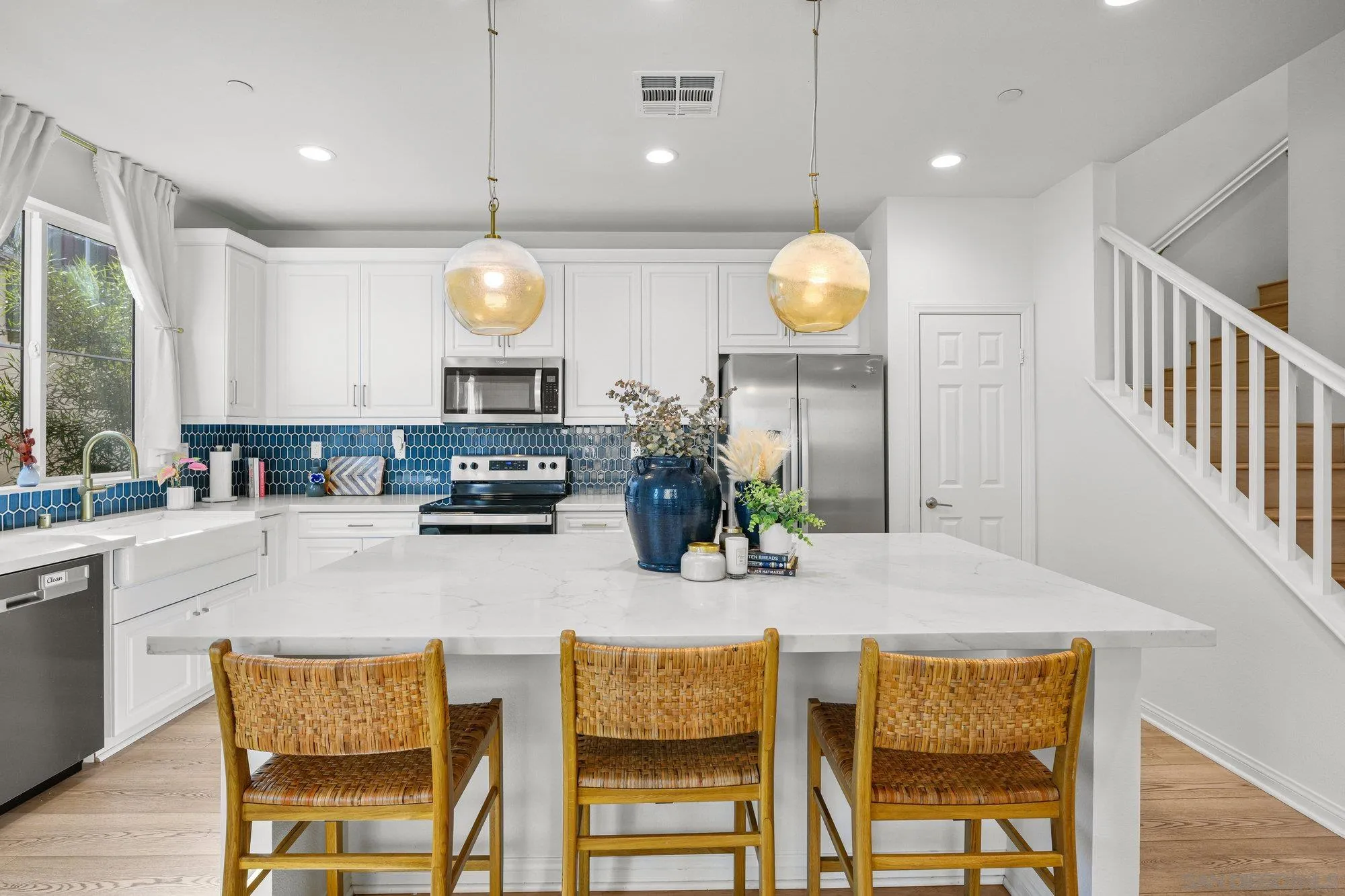 2612 Babaco Street Spring Valley, CA 91977 - Photo 6 of 37 a kitchen with dining table and chairs