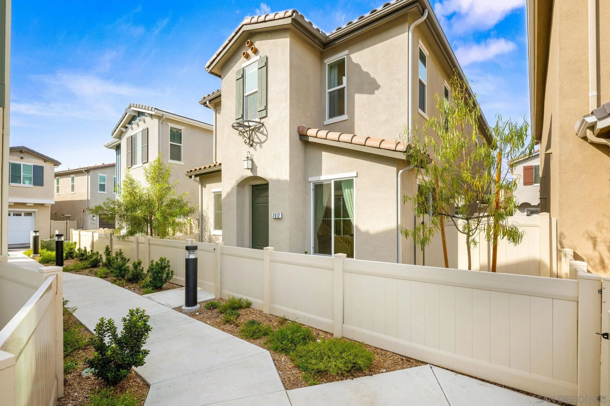 2612 Babaco Street Spring Valley, CA 91977 - Photo 10 of 37 a front view of a house with a garden