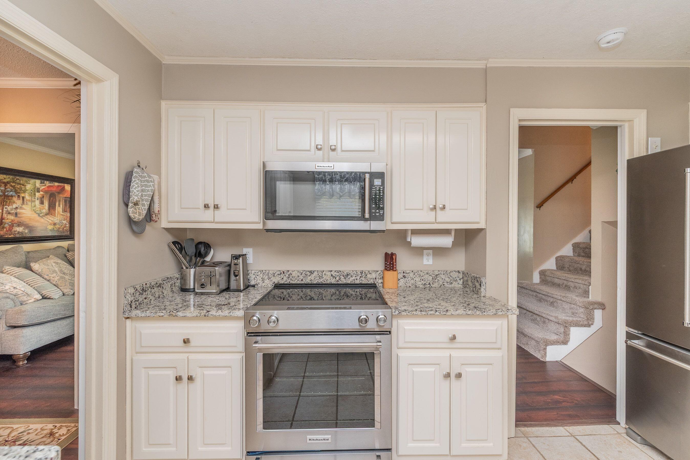 1117 Ridgemont Drive Aiken, SC 29803 - Photo 13 of 49 a kitchen with stainless steel appliances granite countertop a sink stove and cabinets