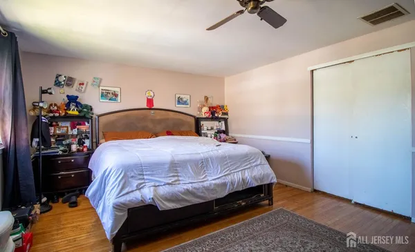 a bedroom with a bed and a closet