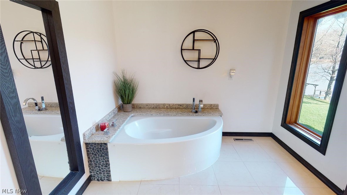 650 Riverfront Road Coolville, OH 45723 - Photo 23 of 30 soaking tub with view of the river