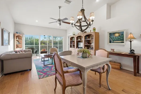 a living room with furniture and kitchen view