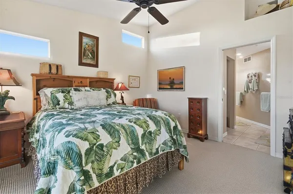a living room with furniture a flat screen tv and a window
