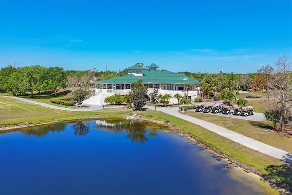 an aerial view of residential houses and lake view