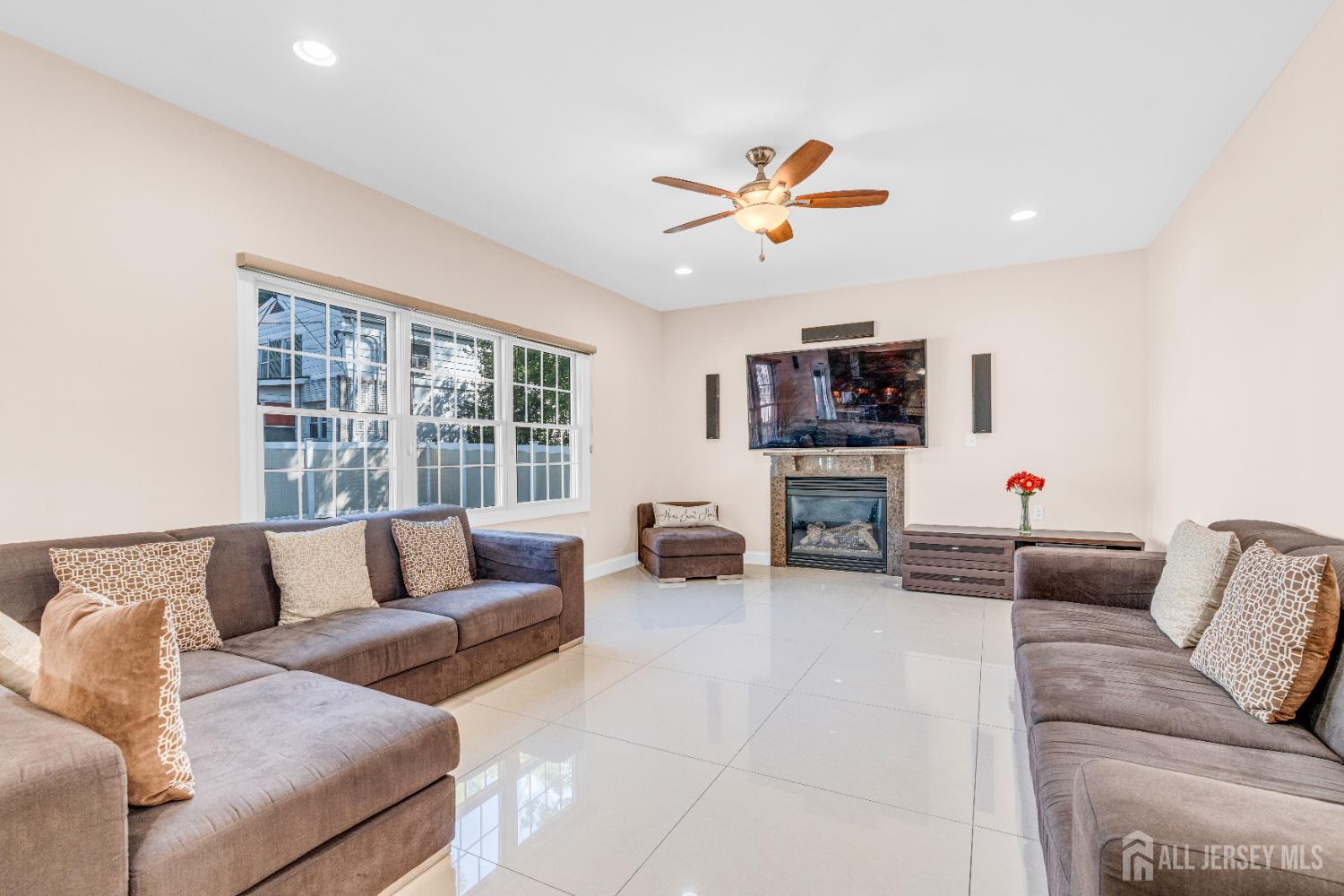 114 Holly Road Iselin, NJ 08830 - Photo 11 of 47 a living room with furniture and a flat screen tv