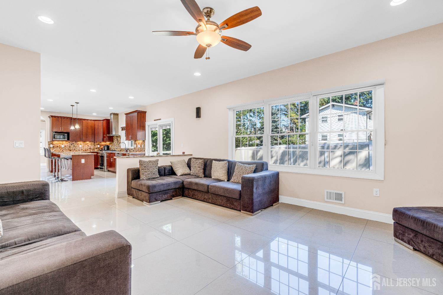 114 Holly Road Iselin, NJ 08830 - Photo 12 of 47 a living room with furniture and a large window
