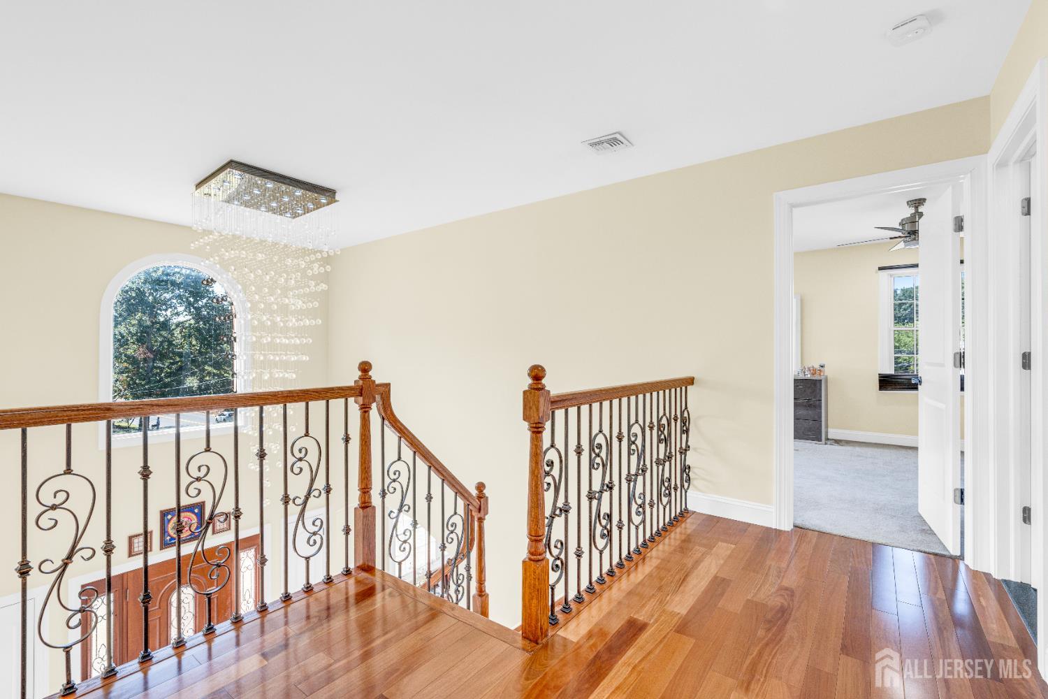 114 Holly Road Iselin, NJ 08830 - Photo 17 of 47 a view of hallway with wooden floor