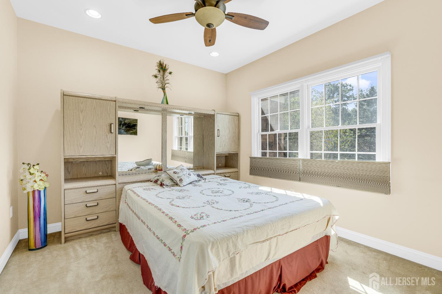 114 Holly Road Iselin, NJ 08830 - Photo 18 of 47 a spacious bedroom with a bed and a dresser