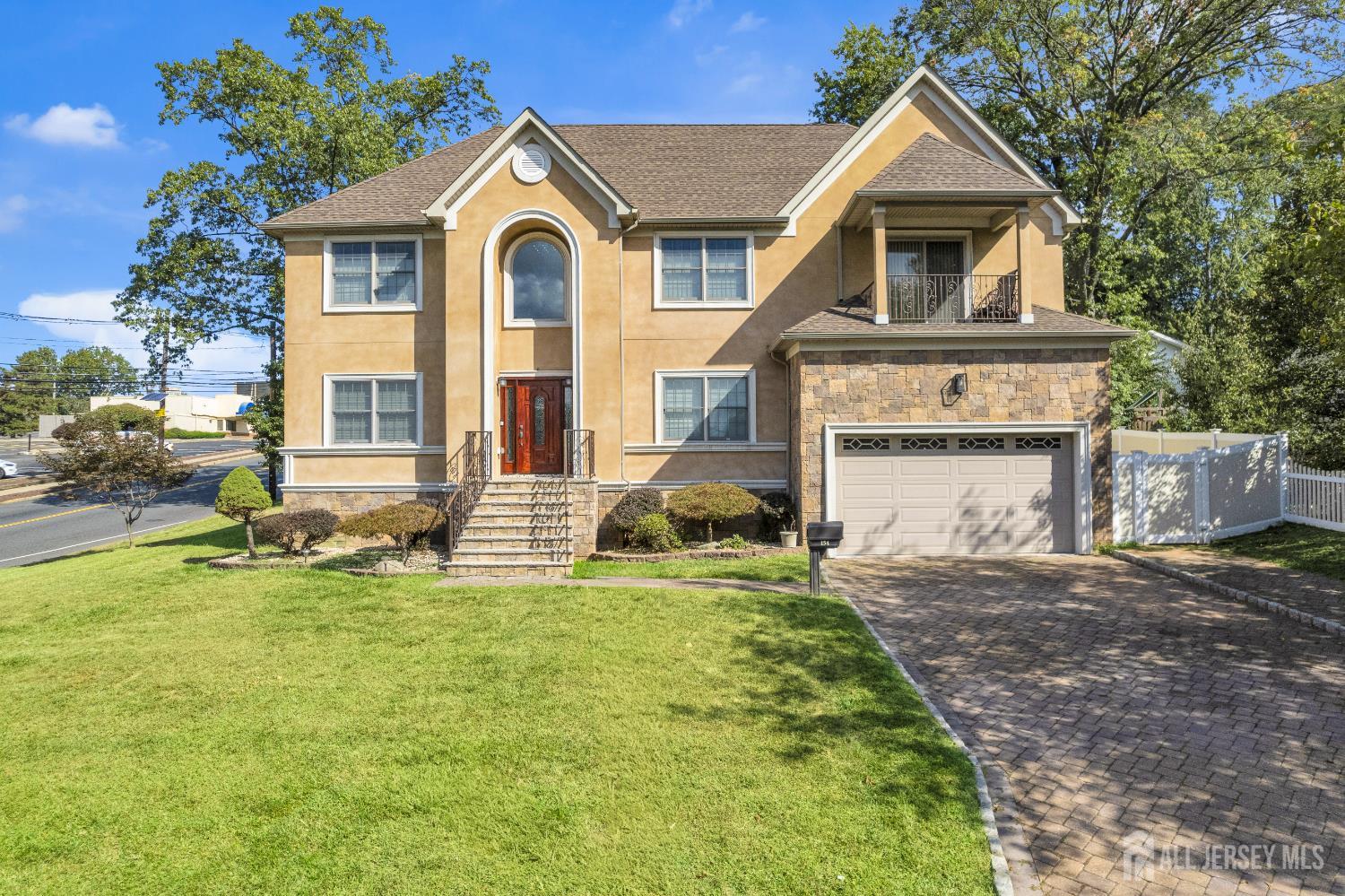 114 Holly Road Iselin, NJ 08830 - Photo 2 of 47 a front view of a house with a yard