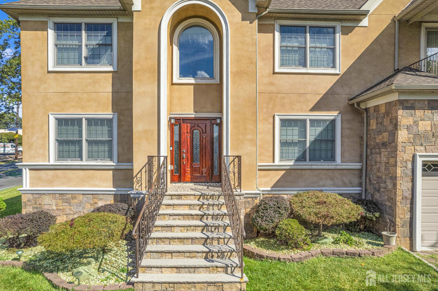 114 Holly Road Iselin, NJ 08830 - Photo 3 of 47 a front view of a house with a yard