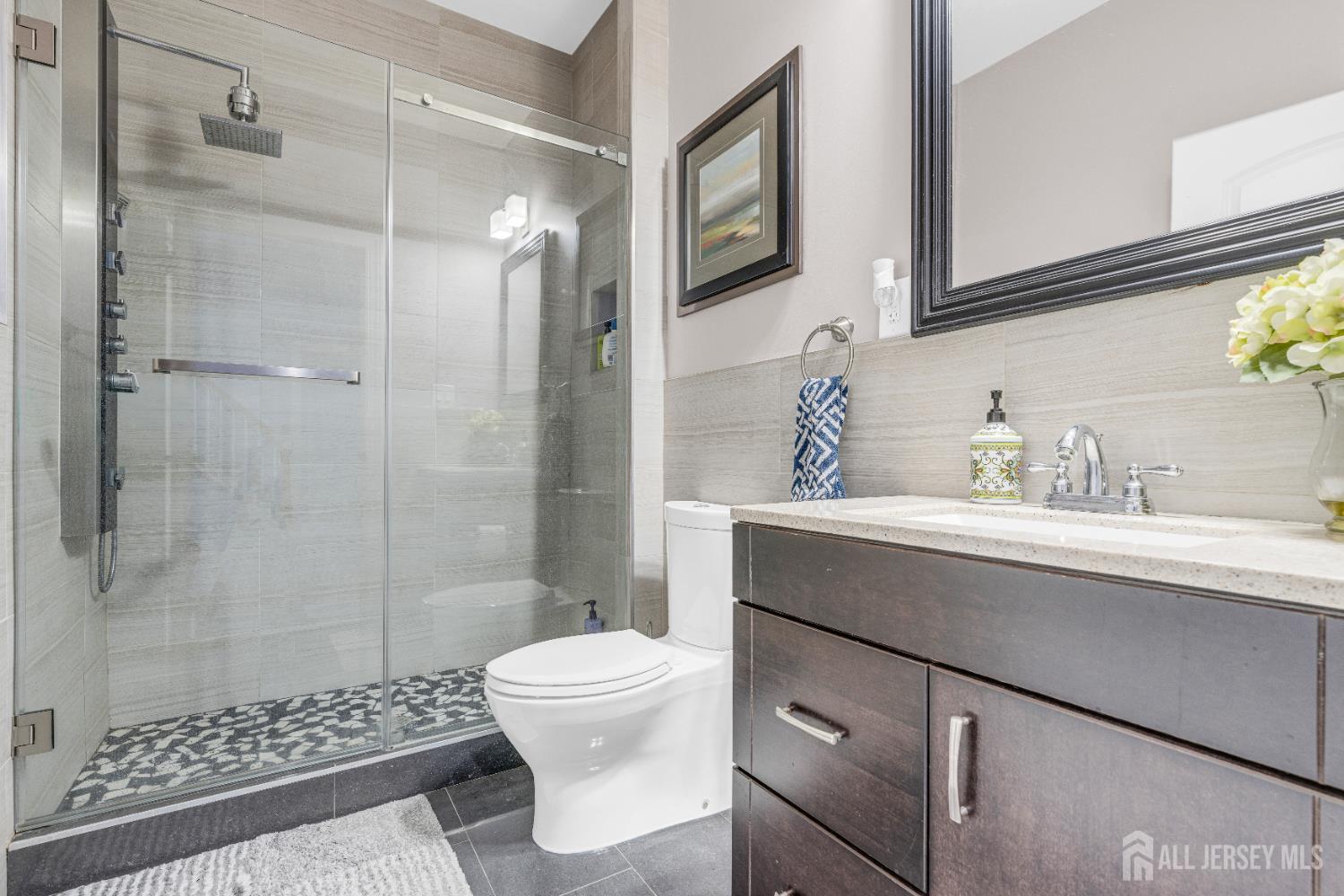 114 Holly Road Iselin, NJ 08830 - Photo 37 of 47 a bathroom with a sink toilet and shower