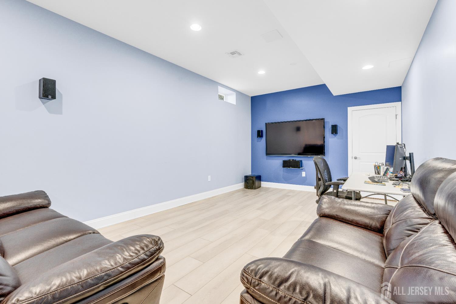 114 Holly Road Iselin, NJ 08830 - Photo 41 of 47 a living room with furniture and a flat screen tv