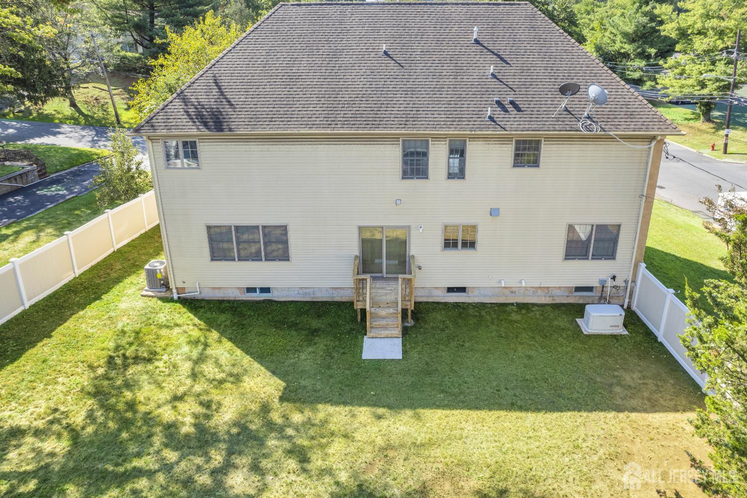 114 Holly Road Iselin, NJ 08830 - Photo 43 of 47 a front view of a house with garden