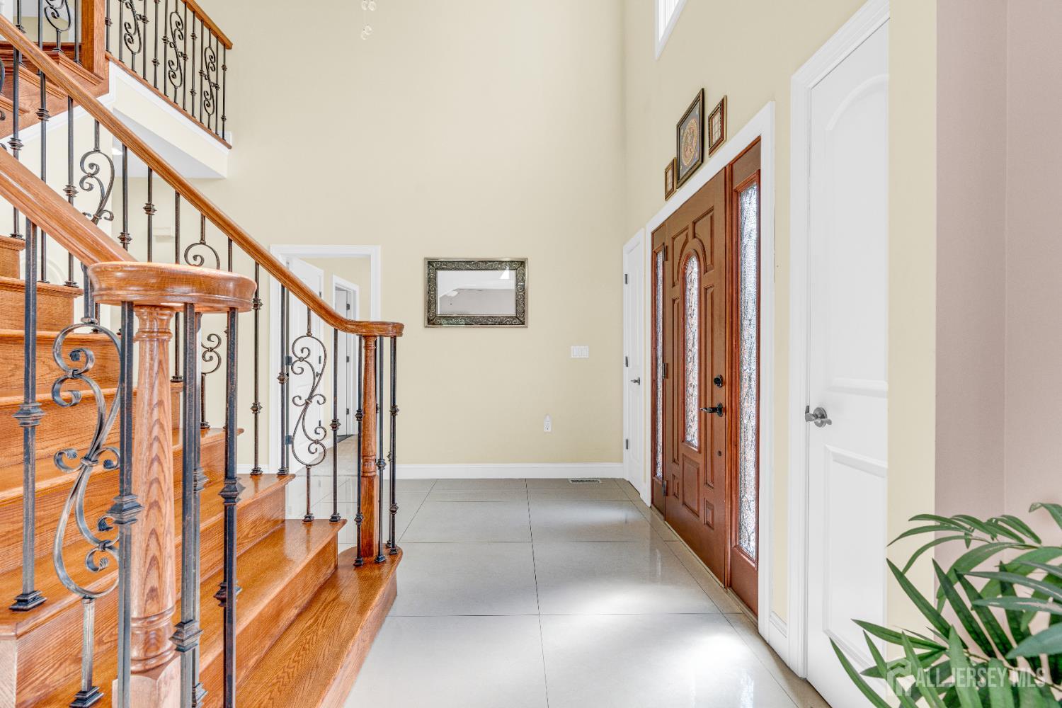 114 Holly Road Iselin, NJ 08830 - Photo 7 of 47 a view of an entryway with staircase
